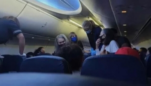 Yolcular birbirine girdi! Amerikan uçağında koronavirüslü hasta öldü