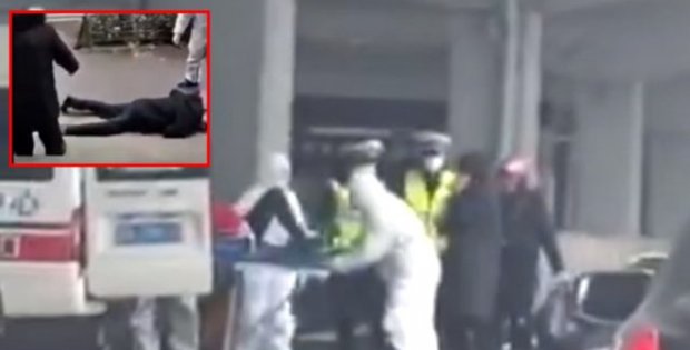 Karantina'ya alınan Wuhan'da koronavirüsüne yakalanan iki kişi sokak ortasında yere yığıldı