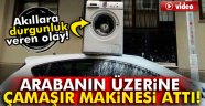 Arabanın üzerine çamaşır makinesi attı